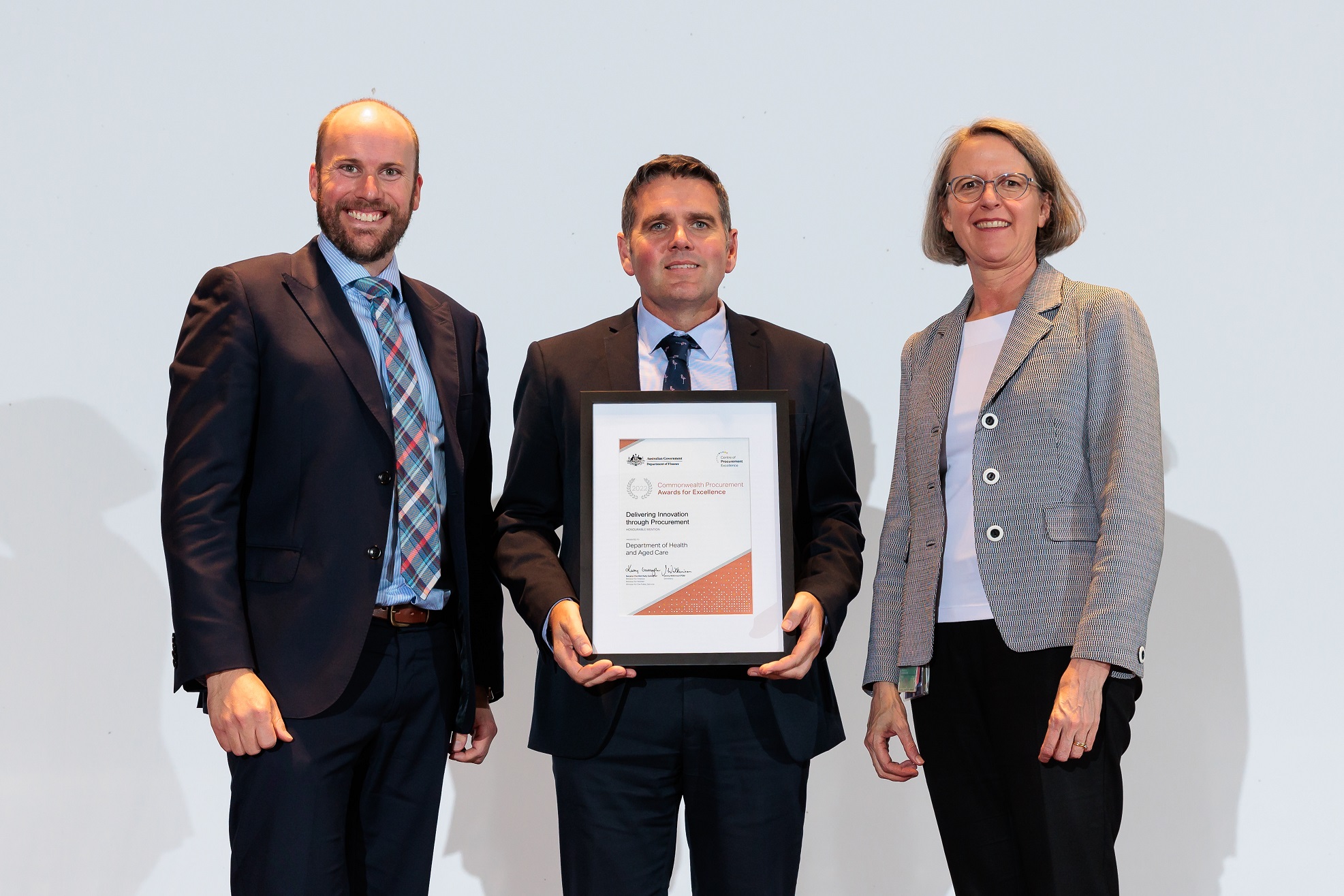 Photograph of Delivering Innovation through Procurement Honourable Mention award recipients – Department of Health and Aged Care with the Finance Secretary