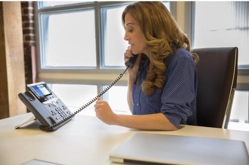 Woman using a CISCO phone