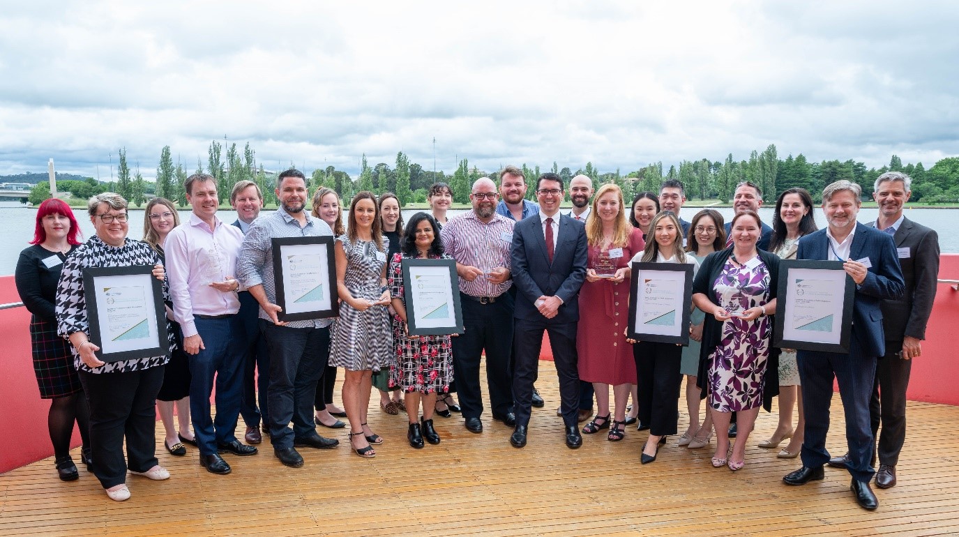 Canberra. Photograph of the Hon. Patrick Gorman and Deputy Secretary Richard Windeyer with the Award recipients. 