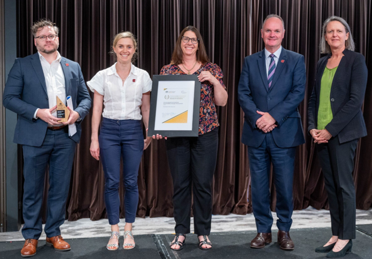 Photograph of the Encouraging Environmental Sustainability through Procurement Gold award recipients – The Australian War Memorial with the Secretary of the Department of Finance.