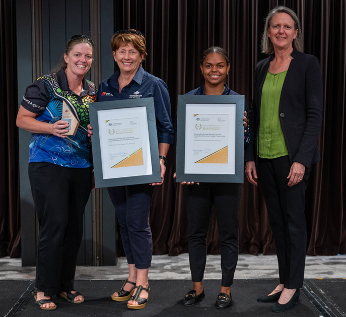 Photograph of the Generating Broader Benefits to the Australian Economy through Procurement Gold award recipients – The Great Barrier Reef Authority with the Secretary of the Department of Finance.